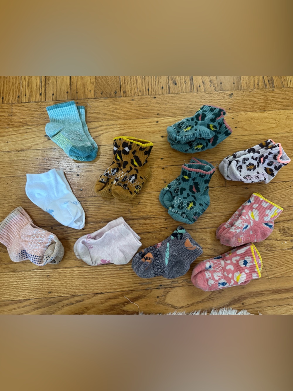 11 pairs Bombas Toddler Socks - gripper and regular.